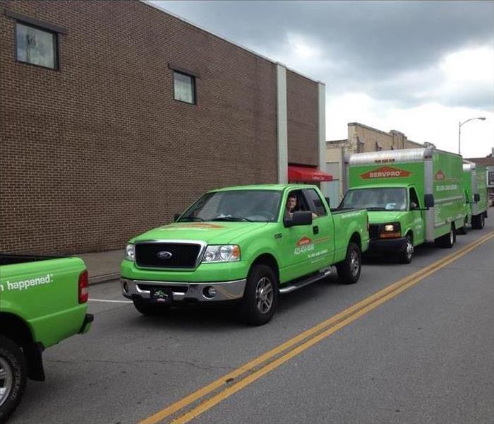 SERVPRO trucks parked out front of a job site