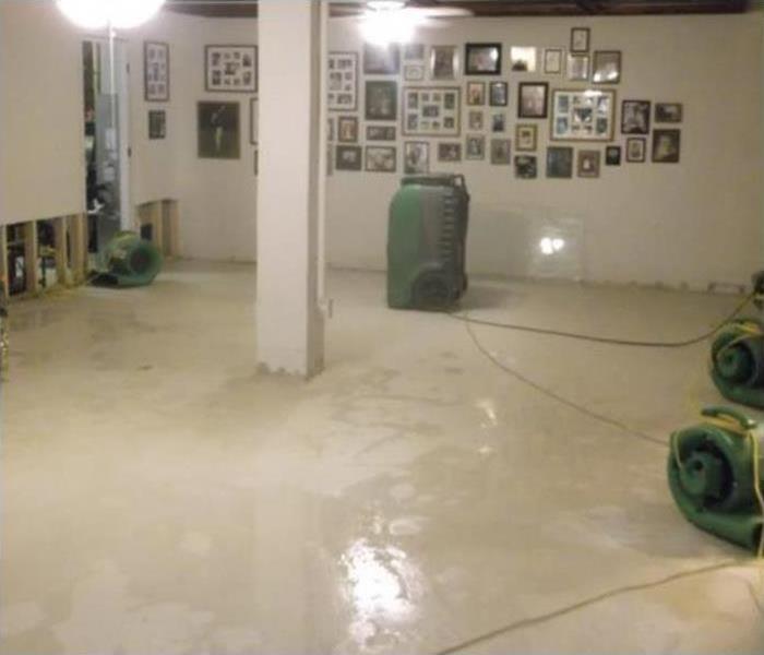 Flood cuts performed on a drywall and drying equipment placed on damaged area