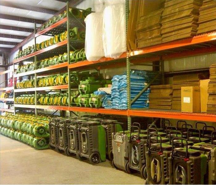 Warehouse filled with drying equipment and cardboard boxes