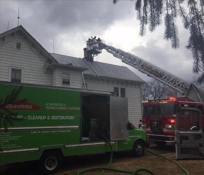fire damage in a home, SERVPRO is present and firefighters