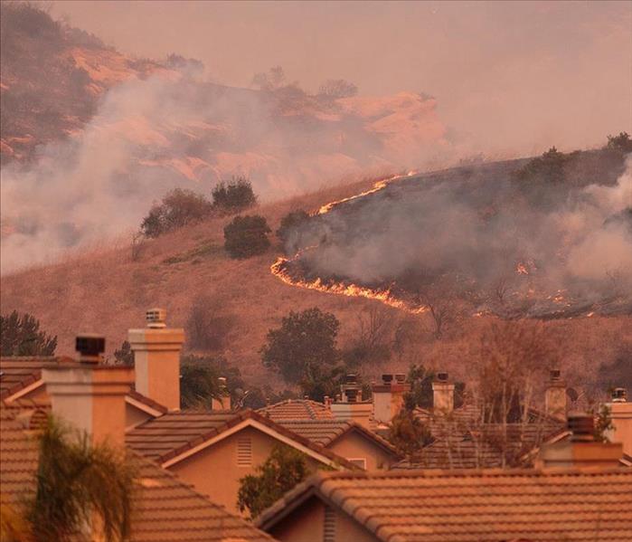 A view of the spreading flames from the Canyon Fire in Anaheim Hills and the City of Orange